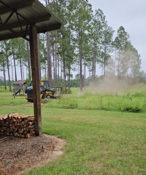 A tractor that is sitting in the grass