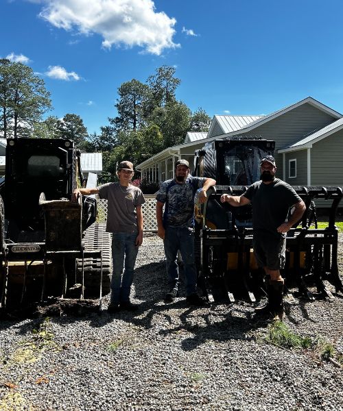 A group of men standing next to a tractor