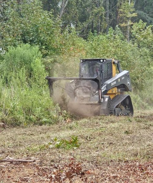 A tractor that is sitting in the dirt